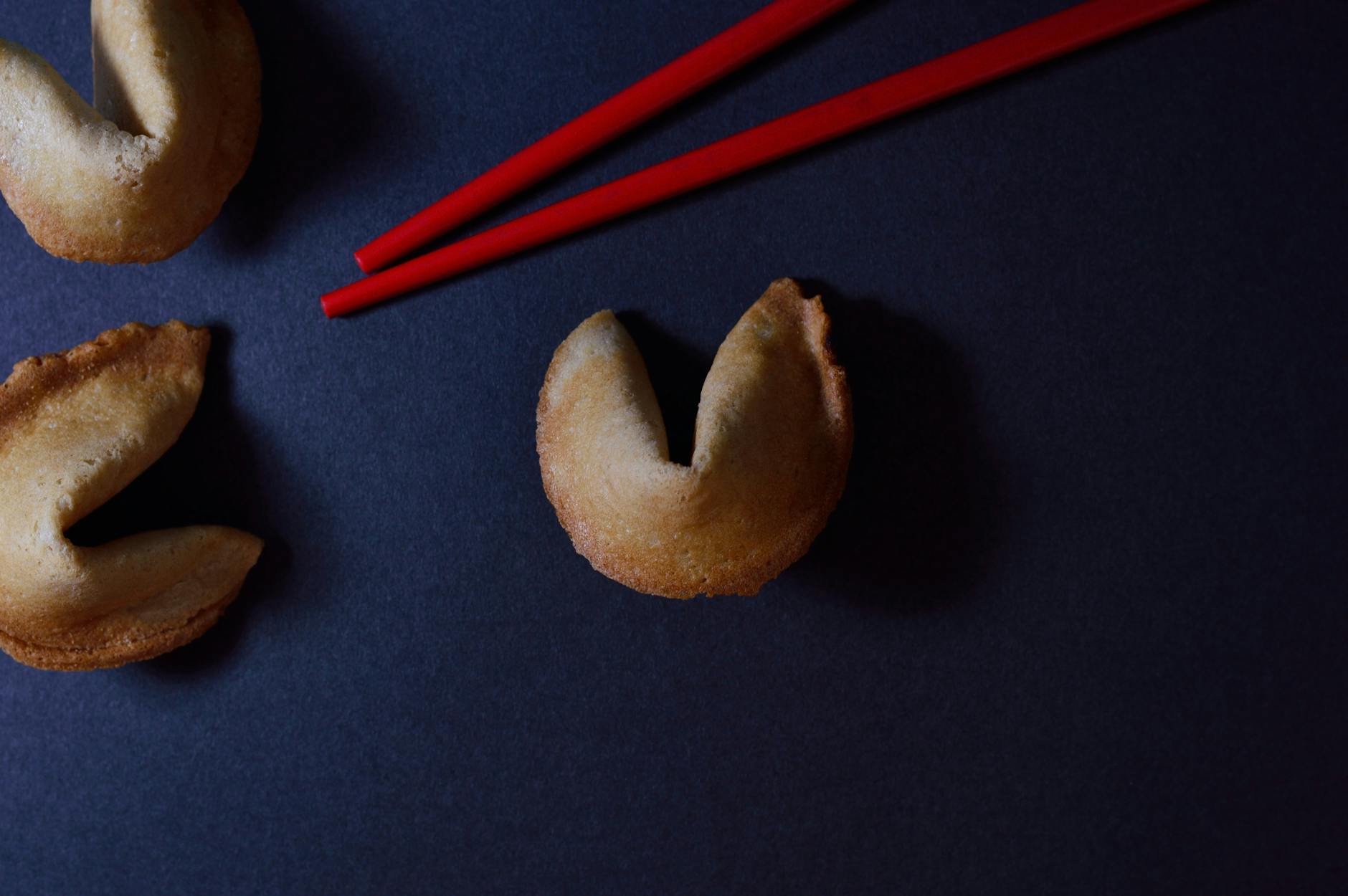 baked pastries beside red chopsticks